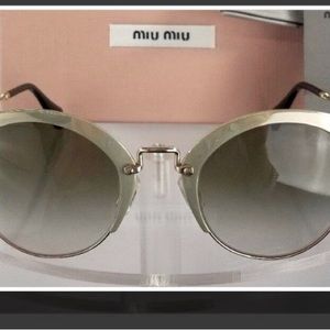 Sunglasses “Miu Miu” silver frames comes with case  Retail $499.00